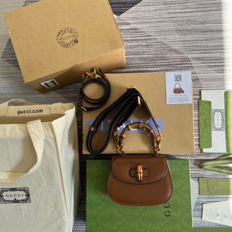 G*u*i top handle bags